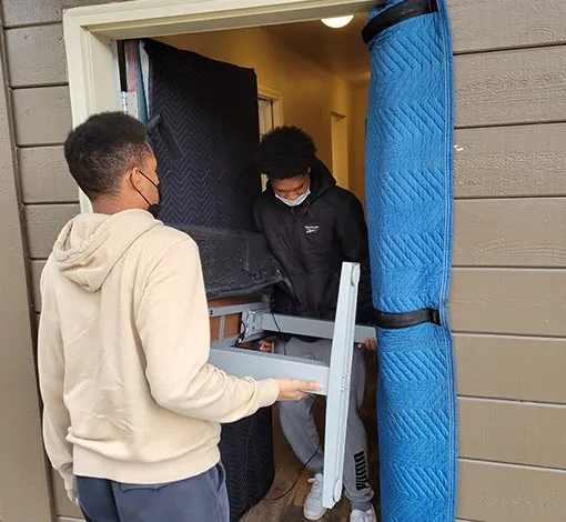 Commercial movers moving a workstation in Portland, OR